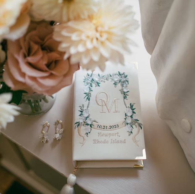 Bridal clutch book with personalized design/crest