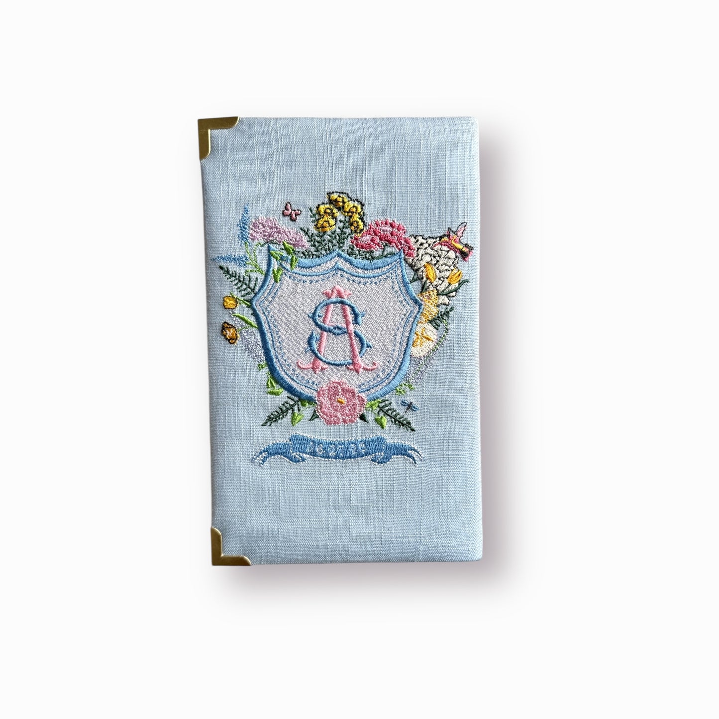 Bridal clutch book with personalized design/crest