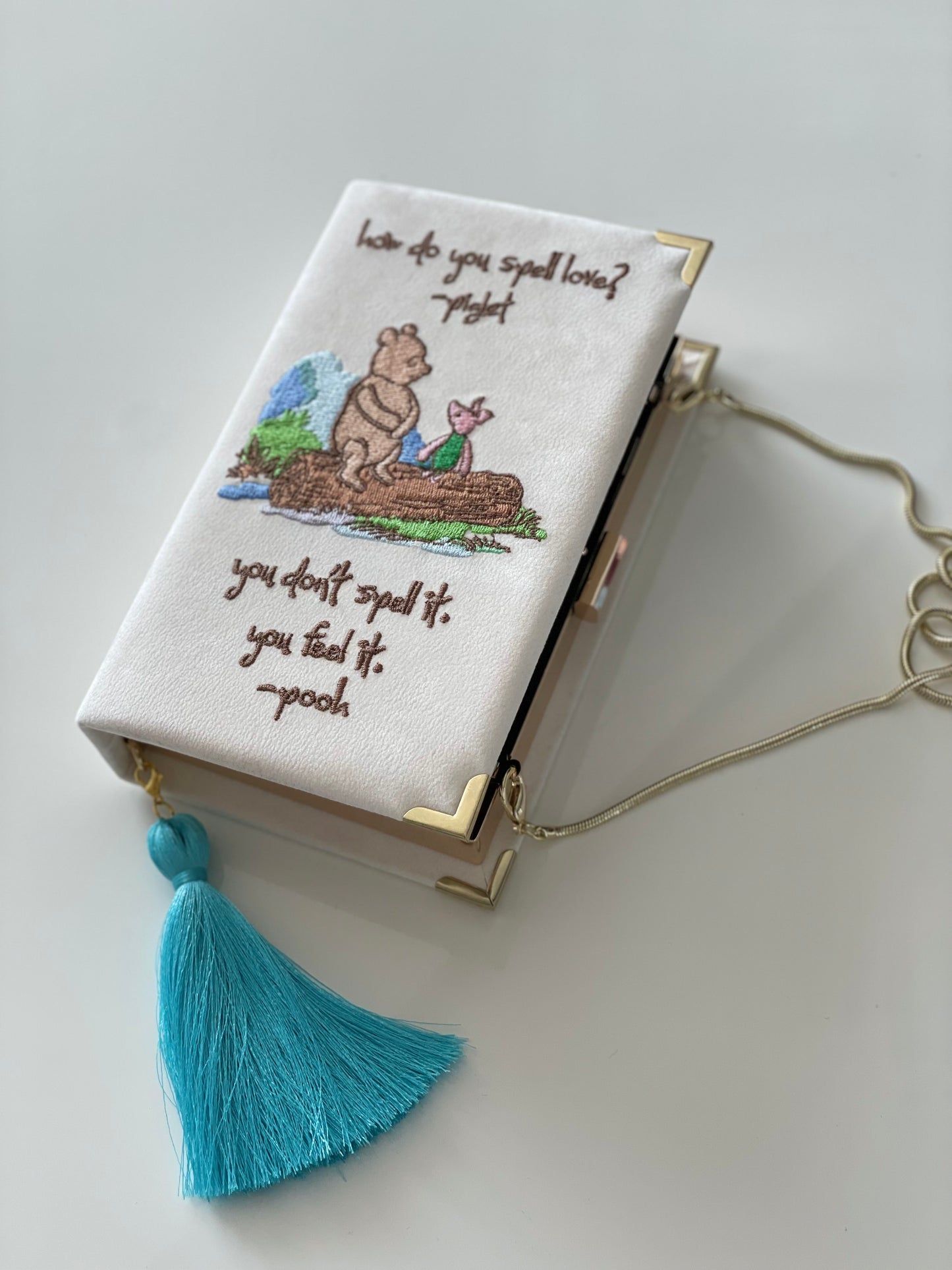Ivory white clutch book with Winnie the Pooh