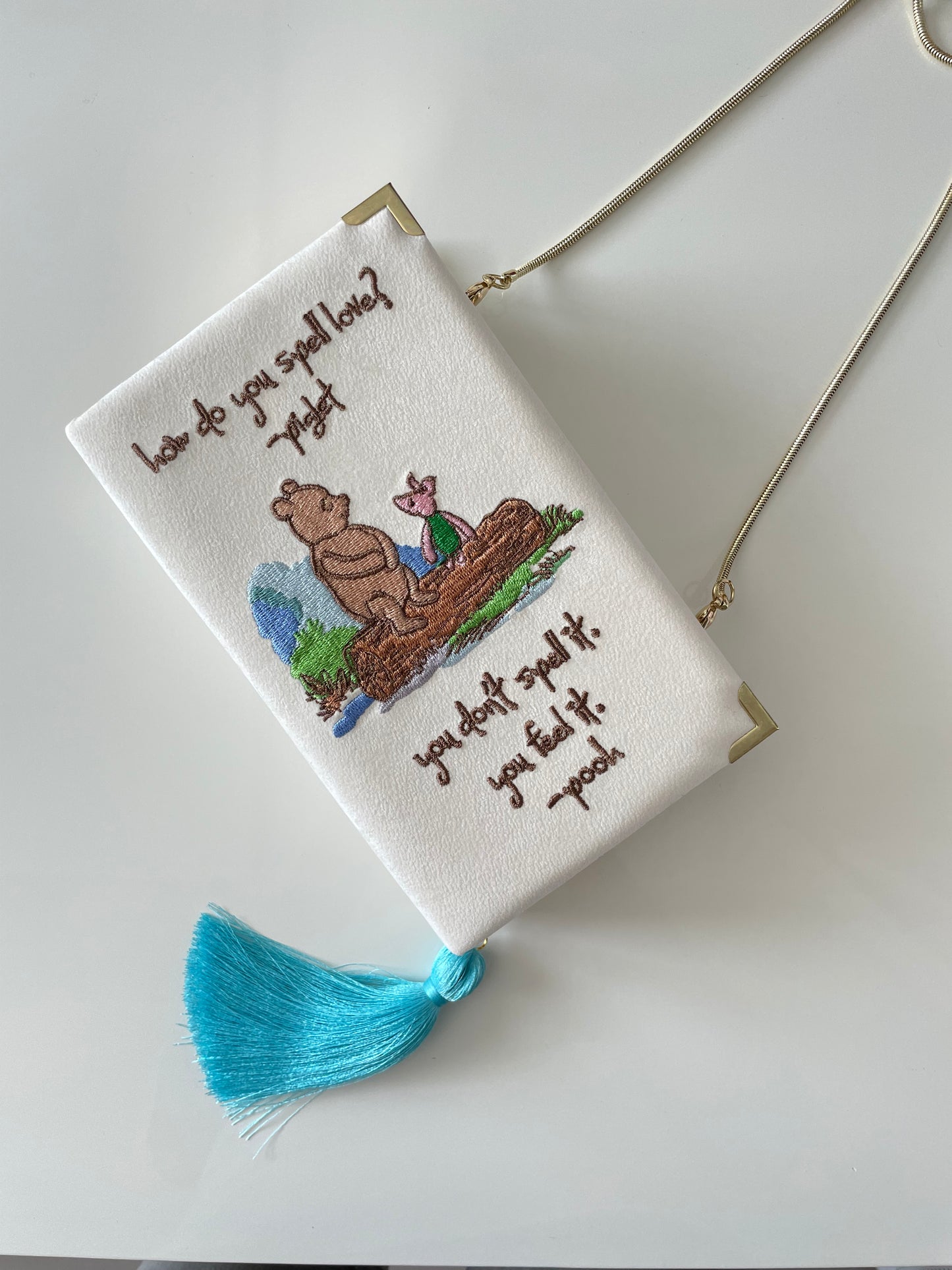 Ivory white clutch book with Winnie the Pooh