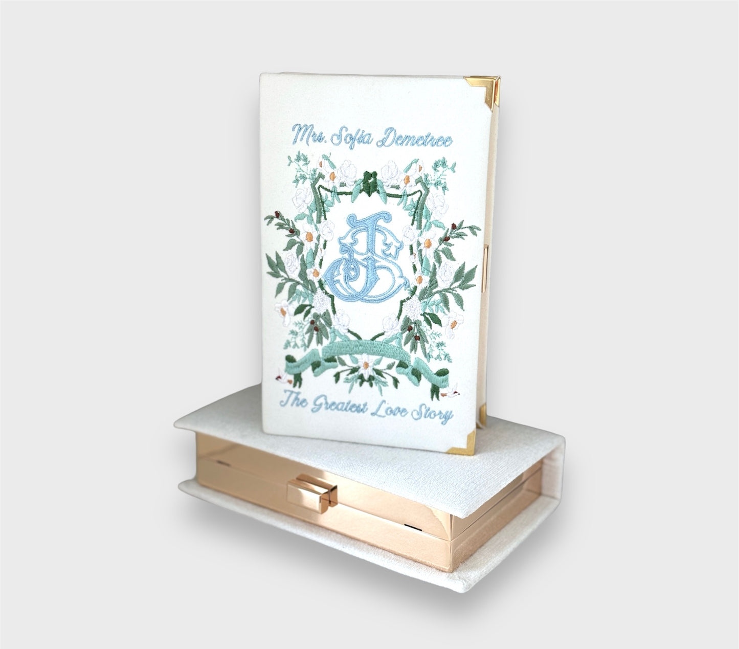 Bridal clutch book with personalized design/crest