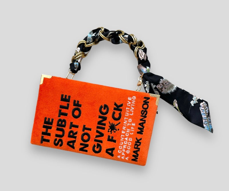 Book clutch purse Mark Manson orange edition