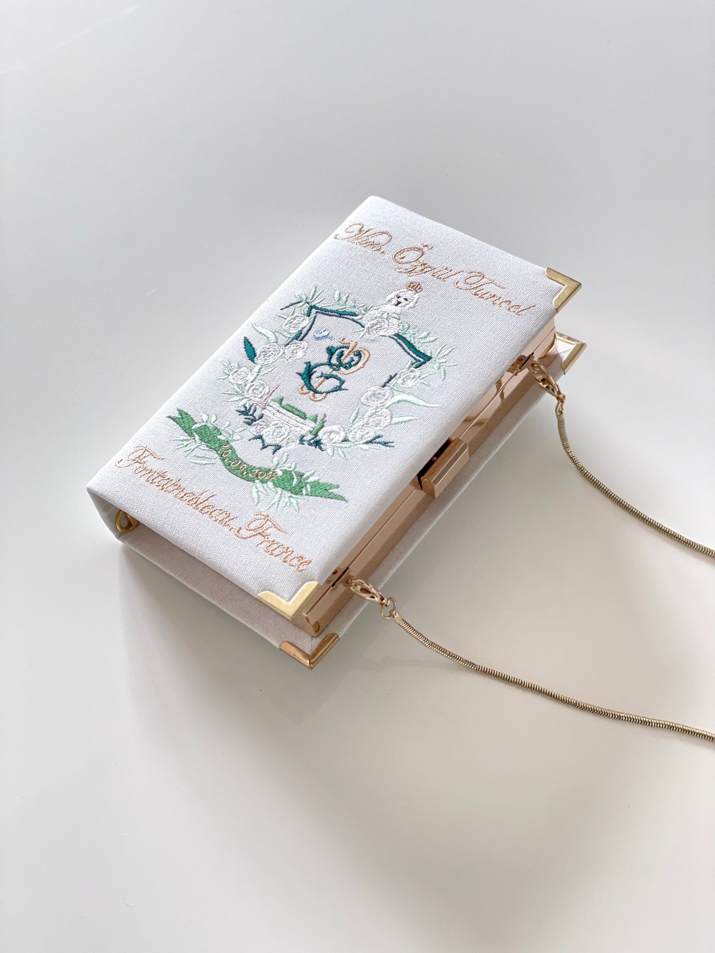 Bridal clutch book with personalized design/crest